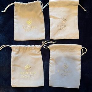 Kendra Scott Cream Pouches with Gold Logo